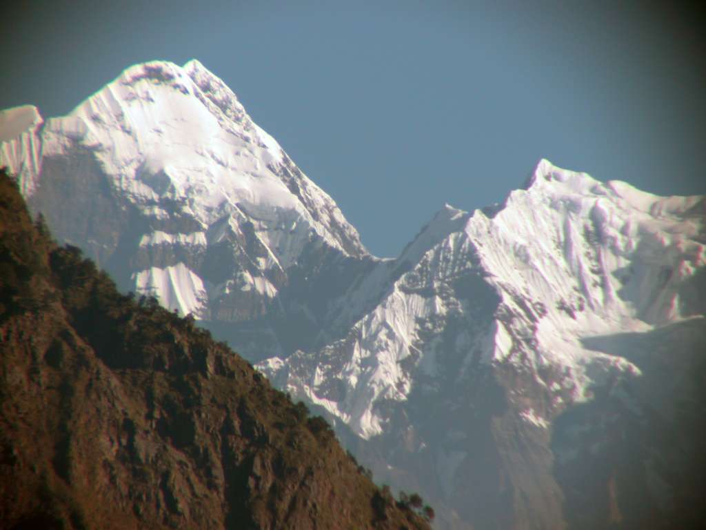 Manaslu 03 01 Shringi Himal From Past Khanibesi I left Labubesi by myself at 6:40. An hour later just after Khanibesi, the peaks of the Shringi Himal (7187m) shone brightly in the morning sun.